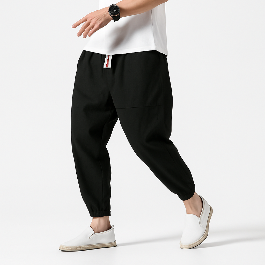 - Yoshika Loose-Fit Drawstring Trousers